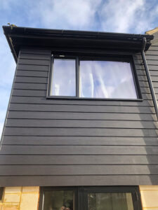 Black James Hardie cladding around window