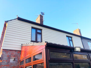 Cream Hardiplank cladding installation