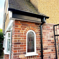 New black uPVC bargeboard over porch window