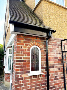 New black uPVC bargeboard over porch window