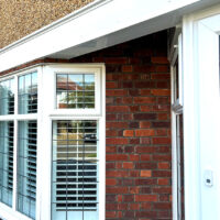 Replacement white uPVC bargeboards over bay window