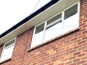 Replacement soffits and guttering over window