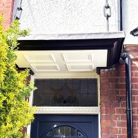 Bespoke door canopy with metal supporting straps