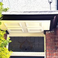 White mouldings on bespoke door canopy