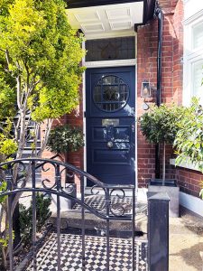Blue front door with bespoke door canopy above