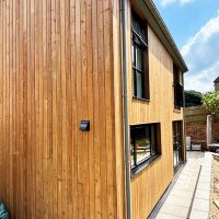 Redwood cedar cladding after Brunnea treatment
