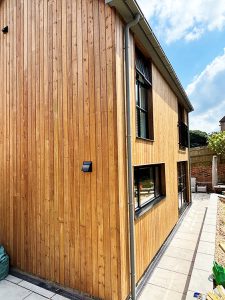 Redwood cedar cladding after Brunnea treatment