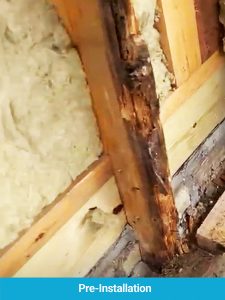 Rotting timbers behind old cladding