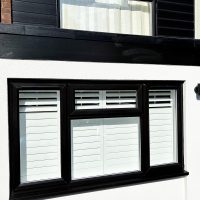 Black fascia boards installed with matching black PVC cladding