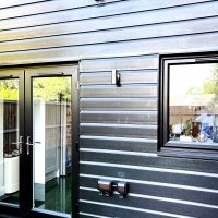 Black PVC Shiplap cladding at rear of property