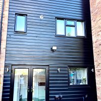 Re-installed black PVC cladding at rear
