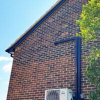 Side of house showing new soffits and fascias installation.