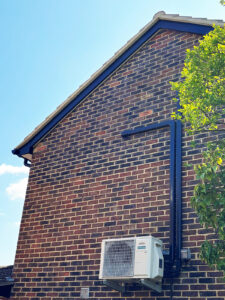 Side of house showing new soffits and fascias installation.
