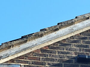 Pre-installation photo showing old rotten fascias and soffits