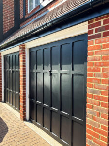New gutter replacement above repainted garage doors